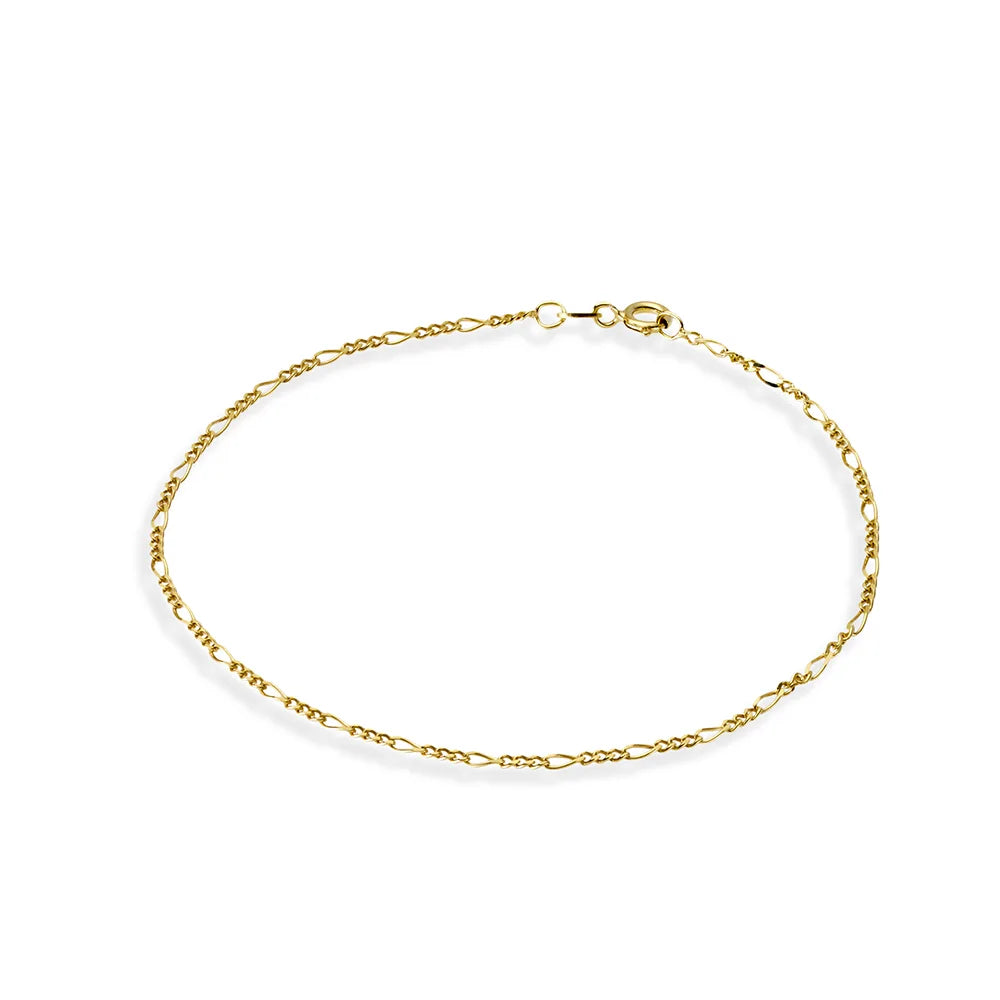 Yellow gold plated figaro chain anklet with a delicate sequence of short and long links, designed for a refined look, adjustable length for personalized comfort.