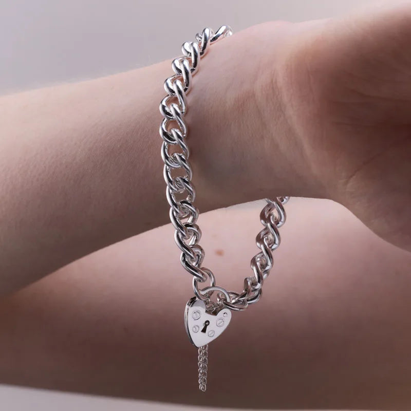 Stylish sterling silver bracelet with a charming heart-shaped padlock, symbolising love and security. The robust design ensures lasting wear.