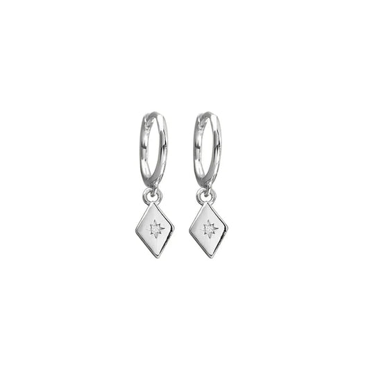 Sterling silver half hoop earrings with a diamond-shaped charm, accented by a sparkling cubic zirconia. Modern and timeless design, measuring 23 x 6 mm.