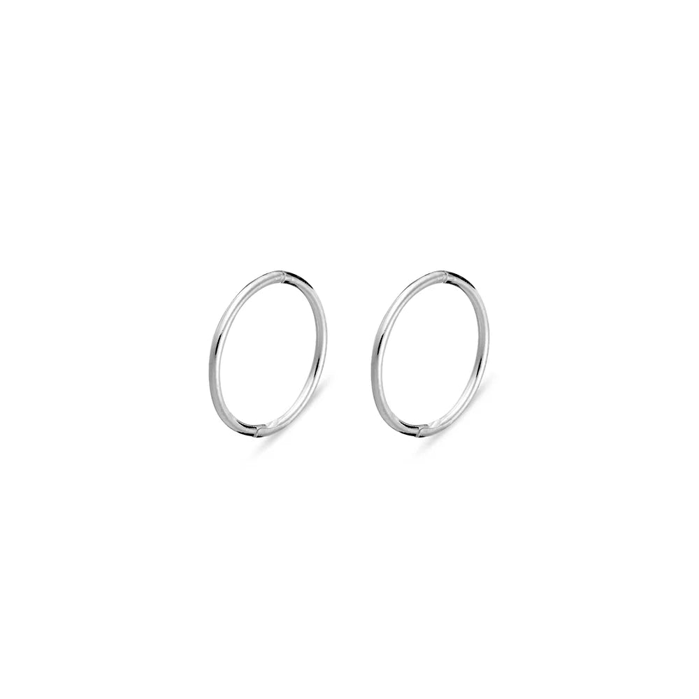 Sterling silver hinged sleeper earrings with a sleek, minimalist design, available in 8mm size. Hypoallergenic and anti-tarnish, perfect for daily wear.