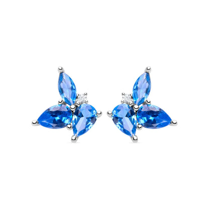 Sterling silver earrings featuring vibrant marquise-cut blue topaz gemstones arranged in a floral design, perfect for adding elegance to any outfit.