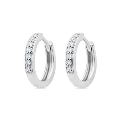 Pair of 9k white gold huggie earrings adorned with sparkling grain-set diamonds, perfect for everyday wear and Australian-inspired luxury.