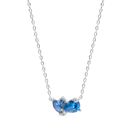 Sterling silver necklace featuring a vibrant blue topaz centerpiece, delicately designed for elegance and everyday wear. Perfect as a timeless accessory.