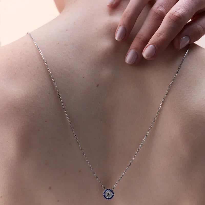 Back view of the Mystical Glace Necklace on a model, highlighting the subtle elegance and protection of the evil eye pendant.