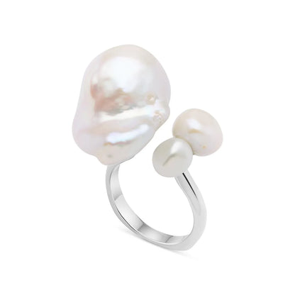 Elegant sterling silver ring adorned with three natural freshwater pearls, perfect for formal and casual wear.